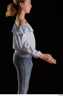 Sarah  1 arm blue blouse dressed flexing side view…